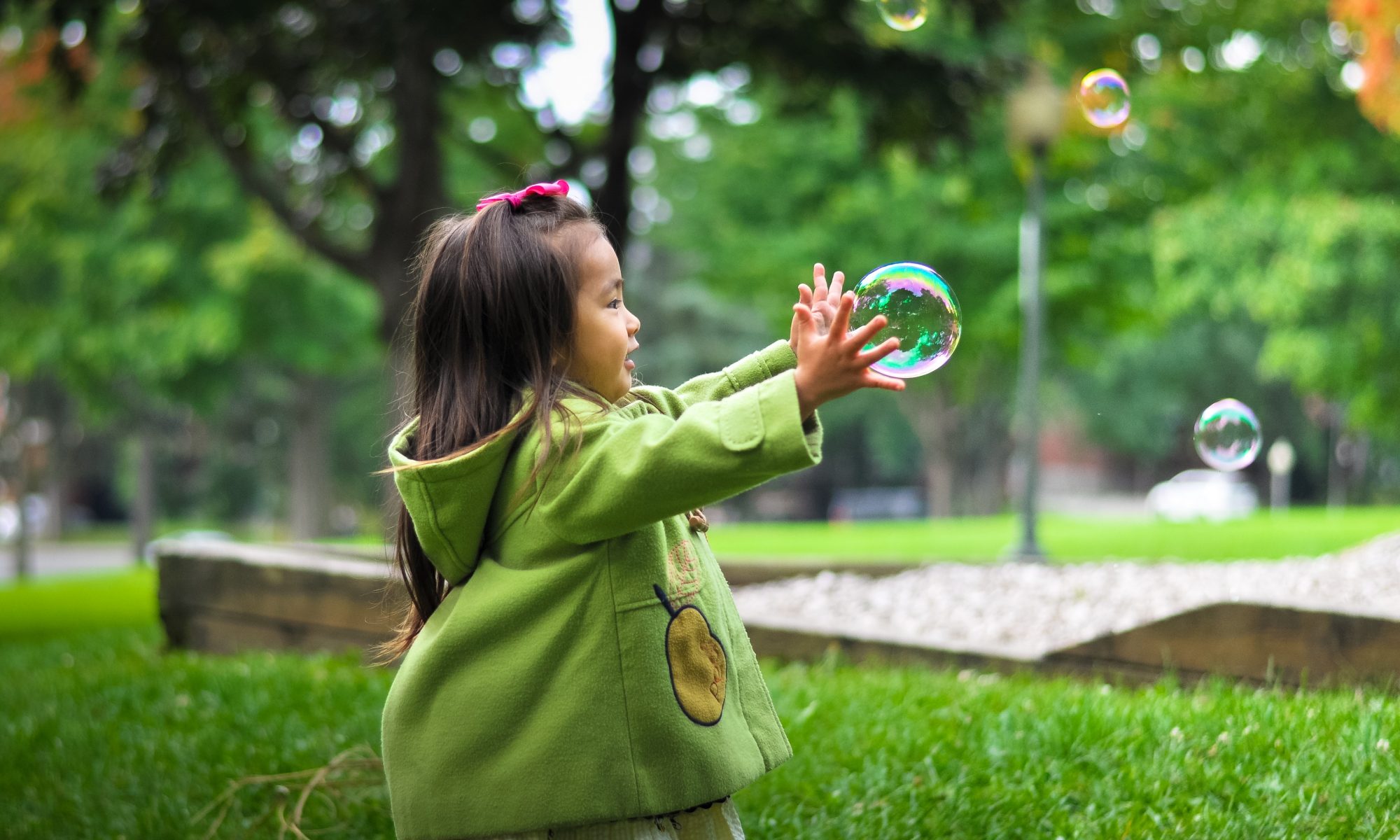Girl playing with bubbles word lists